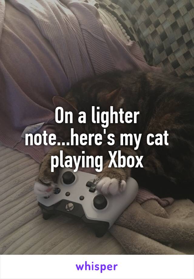 On a lighter note...here's my cat playing Xbox