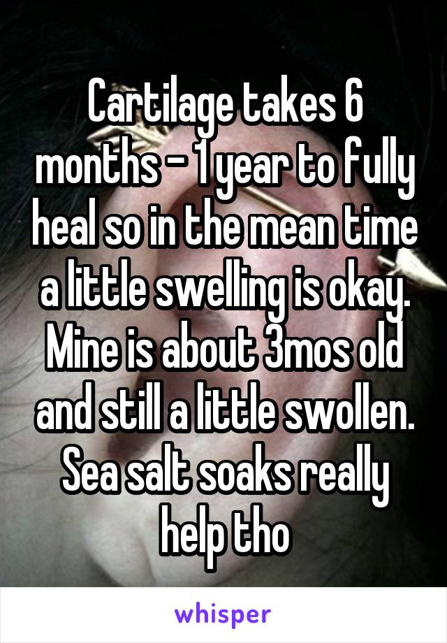 Cartilage takes 6 months - 1 year to fully heal so in the mean time a little swelling is okay. Mine is about 3mos old and still a little swollen. Sea salt soaks really help tho