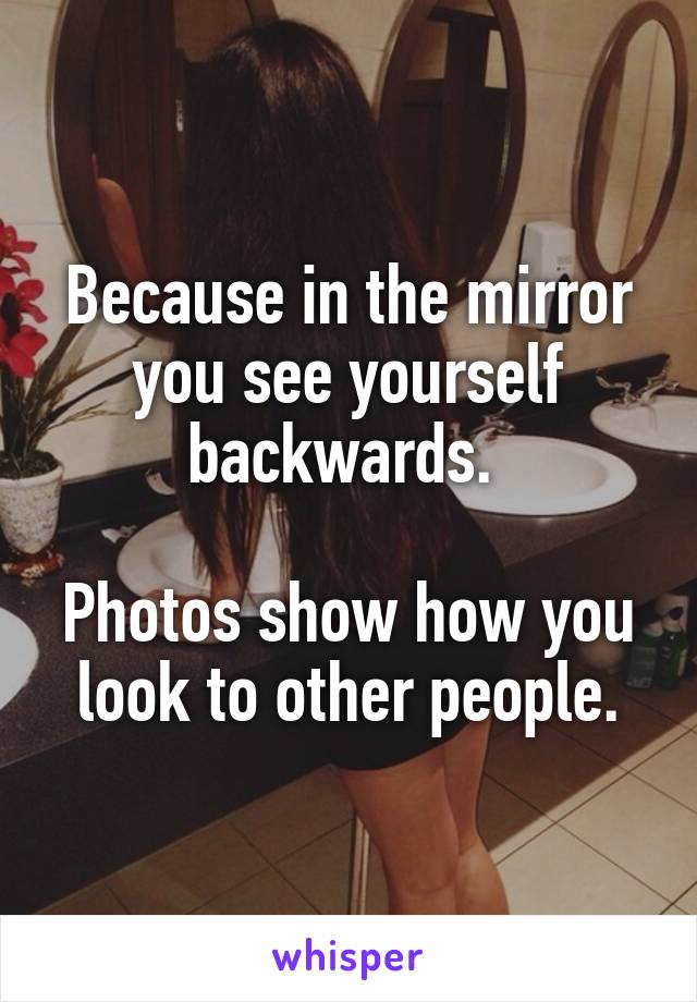 Because in the mirror you see yourself backwards. 

Photos show how you look to other people.