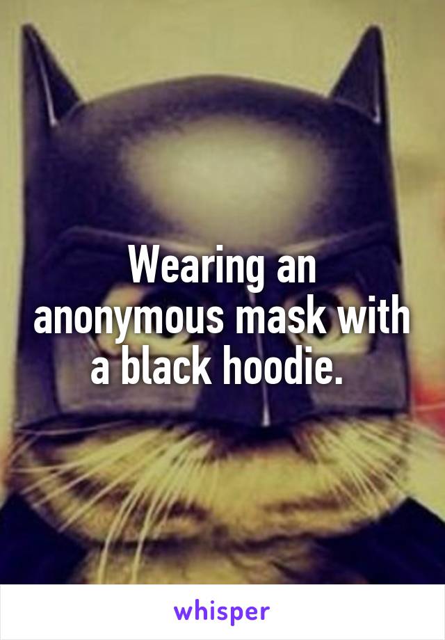 Wearing an anonymous mask with a black hoodie. 
