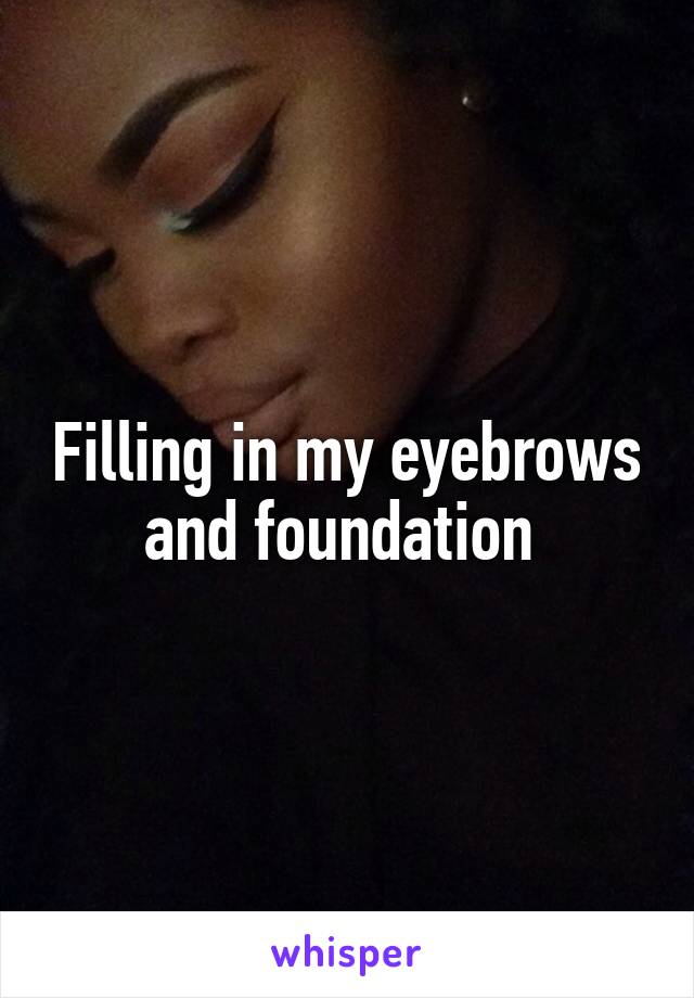 Filling in my eyebrows and foundation 