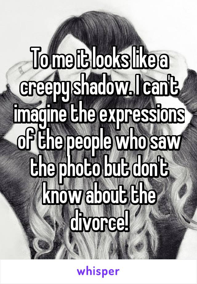 To me it looks like a creepy shadow. I can't imagine the expressions of the people who saw the photo but don't know about the divorce!