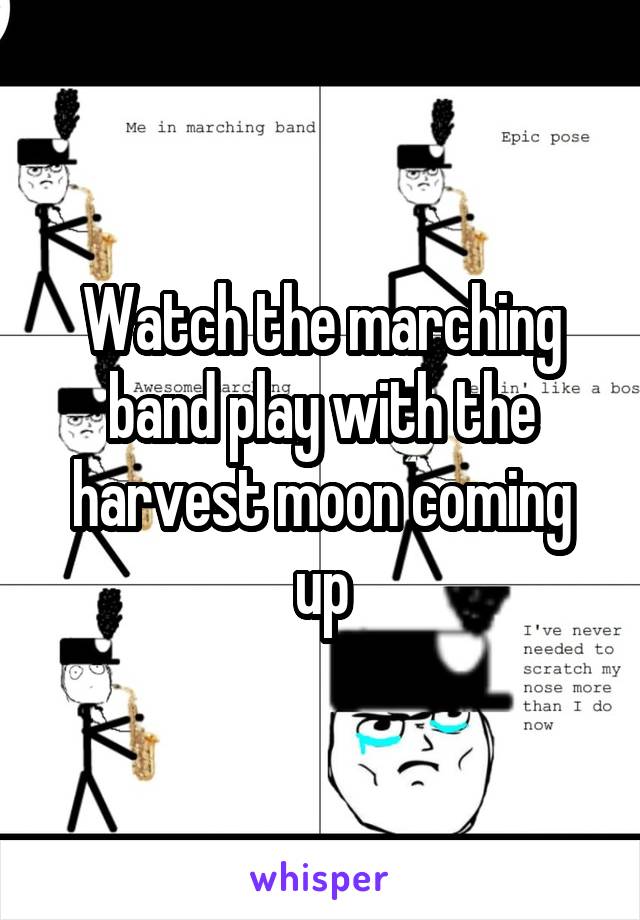 Watch the marching band play with the harvest moon coming up