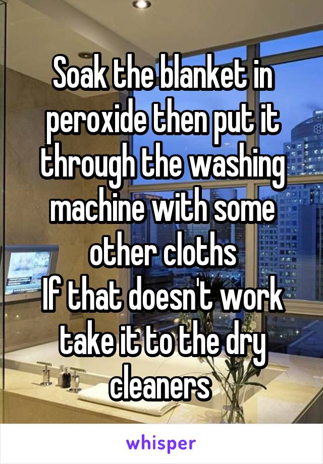 Soak the blanket in peroxide then put it through the washing machine with some other cloths
If that doesn't work take it to the dry cleaners 