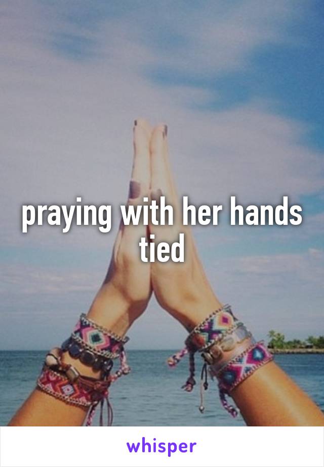 praying with her hands tied