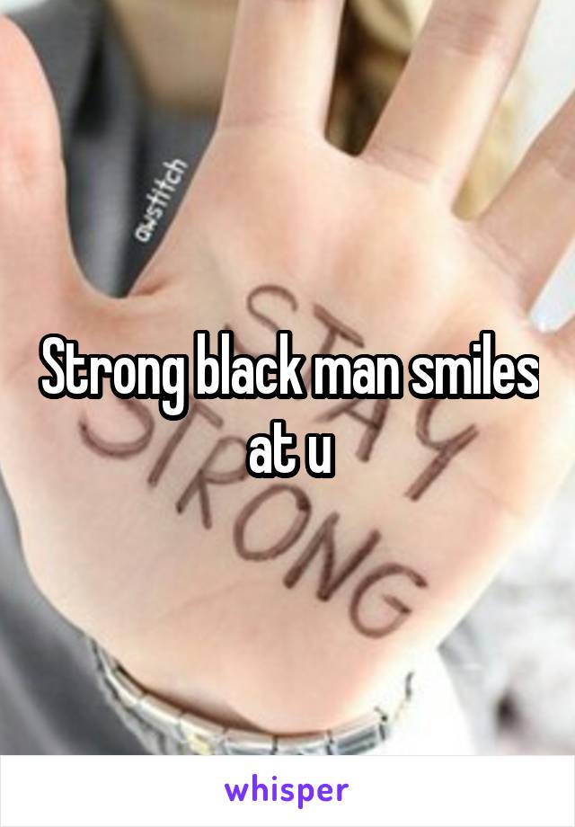 Strong black man smiles at u