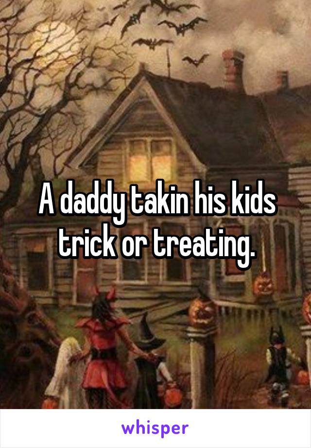 A daddy takin his kids trick or treating.