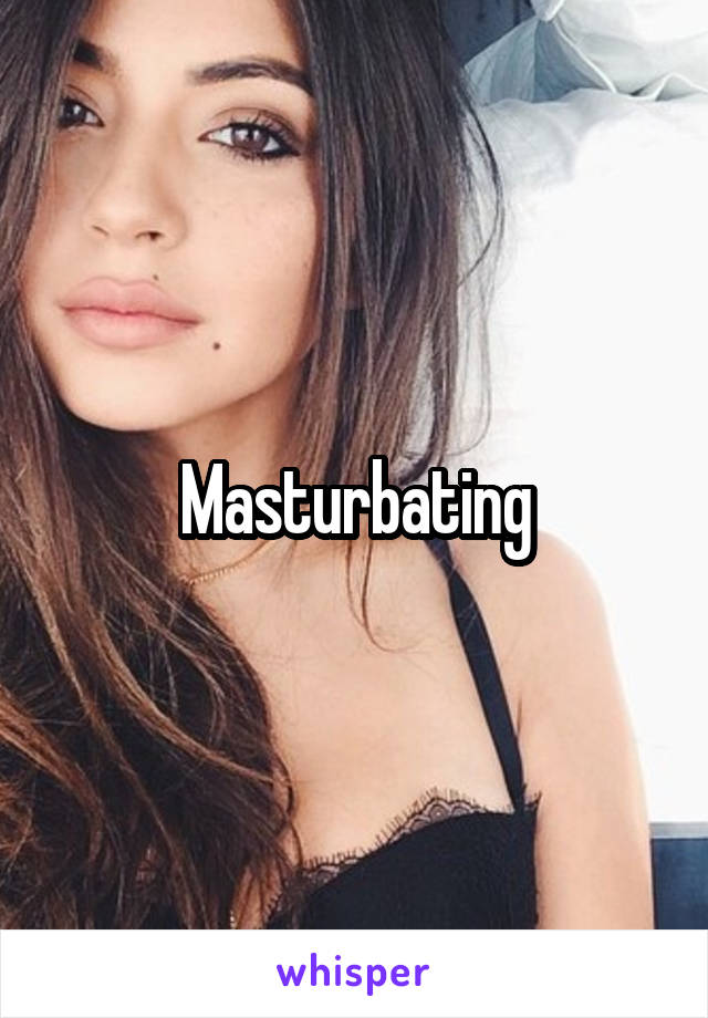 Masturbating