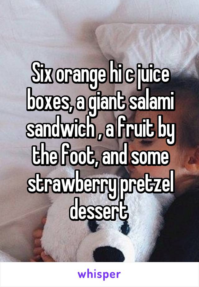 Six orange hi c juice boxes, a giant salami sandwich , a fruit by the foot, and some strawberry pretzel dessert 