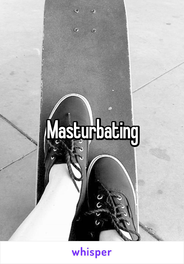 Masturbating