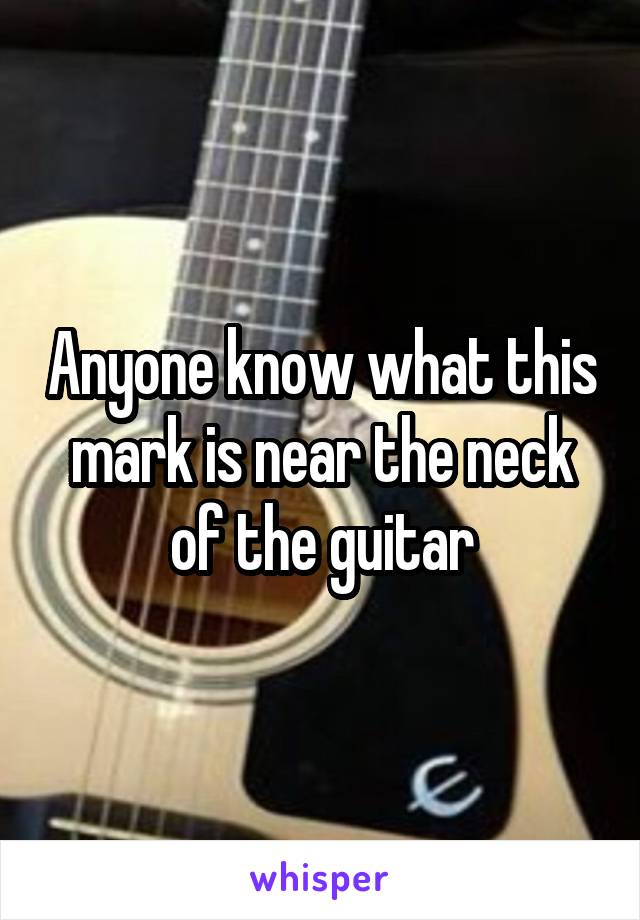 Anyone know what this mark is near the neck of the guitar