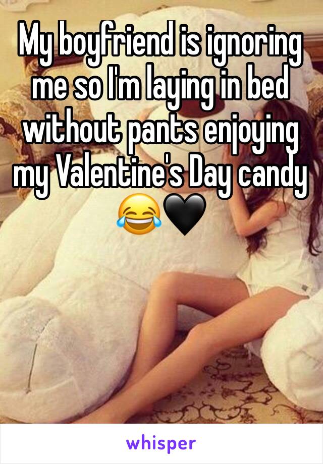 My boyfriend is ignoring me so I'm laying in bed without pants enjoying my Valentine's Day candy 😂🖤