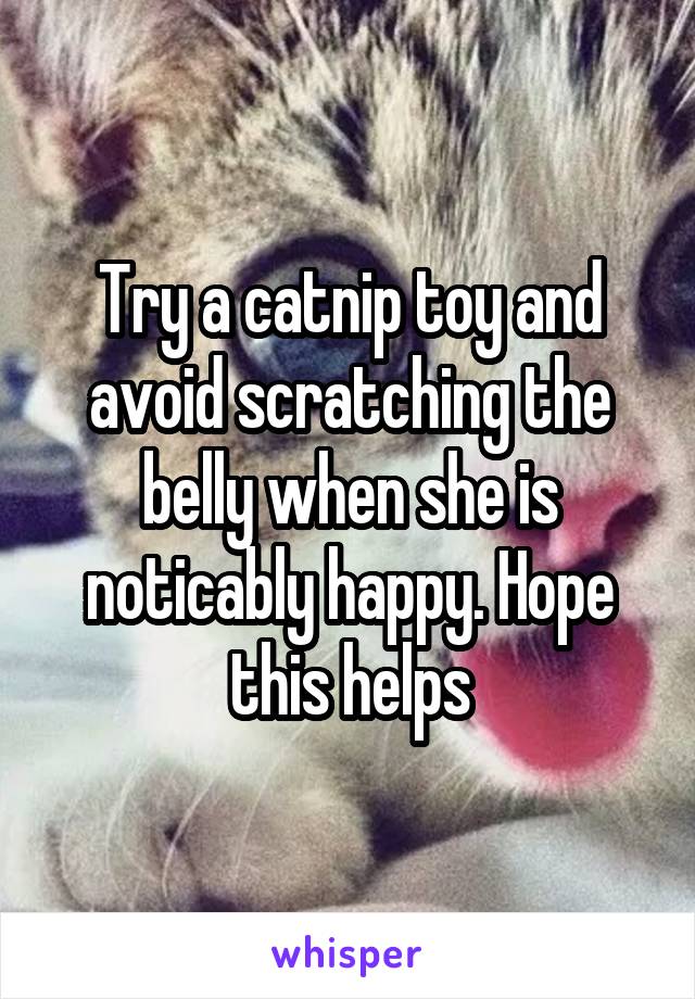 Try a catnip toy and avoid scratching the belly when she is noticably happy. Hope this helps