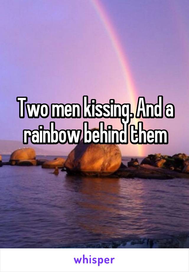 Two men kissing. And a rainbow behind them
