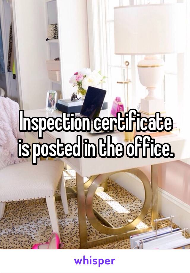 Inspection certificate is posted in the office.