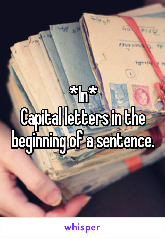 *In*
Capital letters in the beginning of a sentence.
