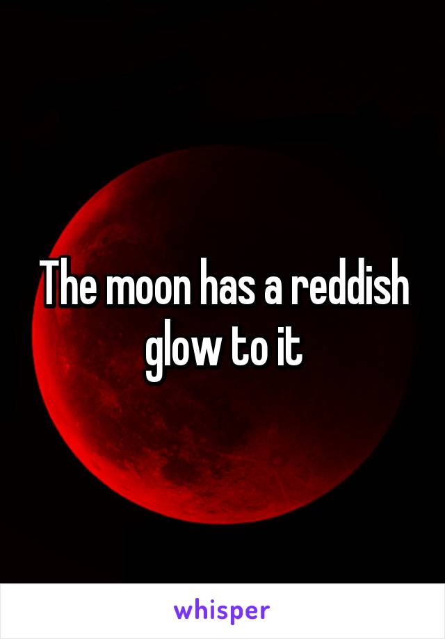 The moon has a reddish glow to it