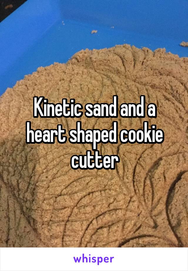 Kinetic sand and a heart shaped cookie cutter