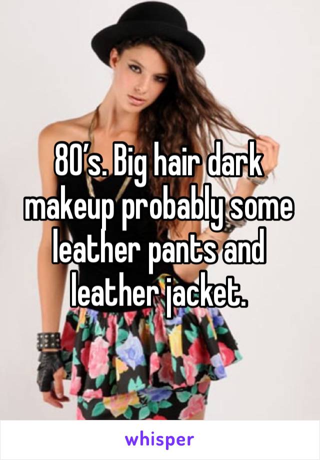 80’s. Big hair dark makeup probably some leather pants and leather jacket. 