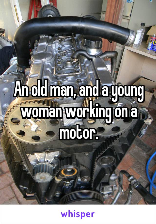 An old man, and a young woman working on a motor.