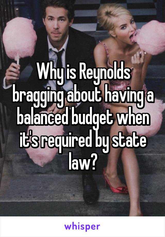 Why is Reynolds bragging about having a balanced budget when it's required by state law?