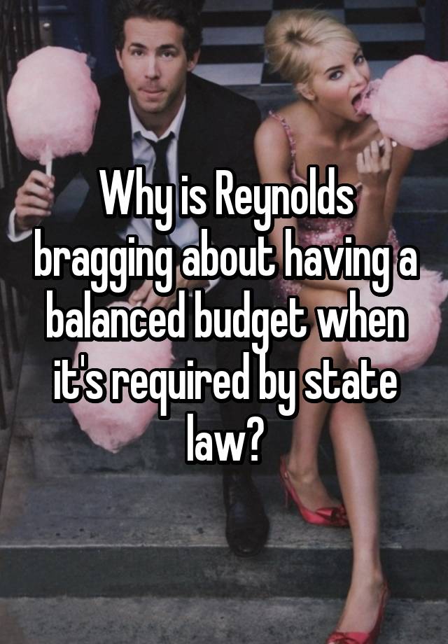 Why is Reynolds bragging about having a balanced budget when it's required by state law?