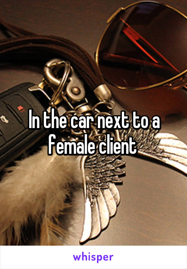 In the car next to a female client 