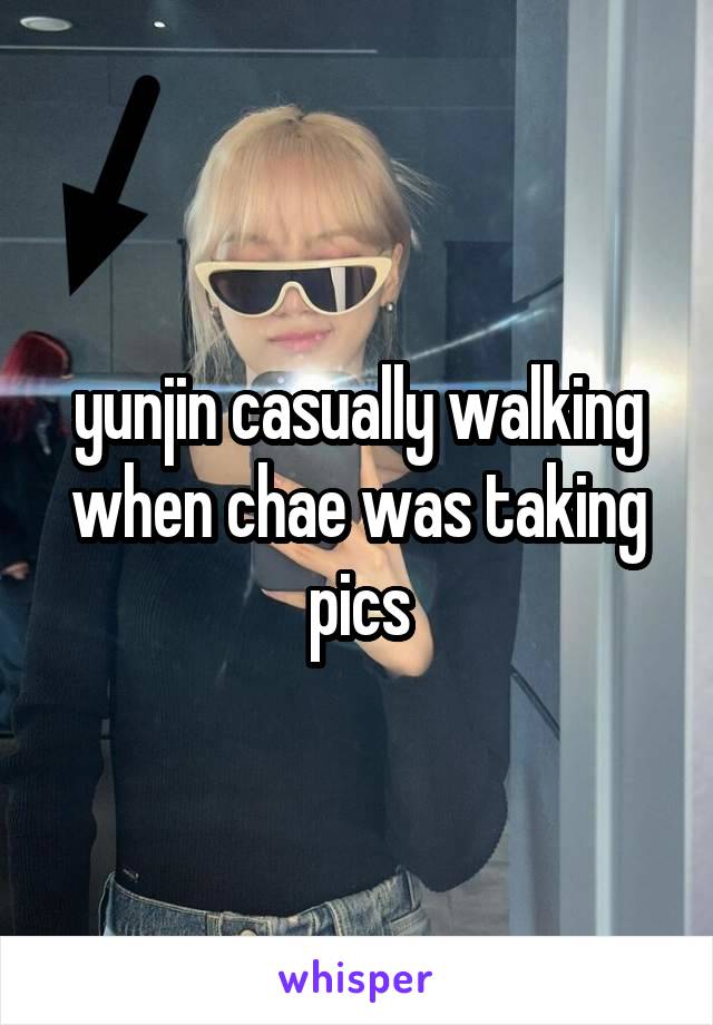 yunjin casually walking when chae was taking pics