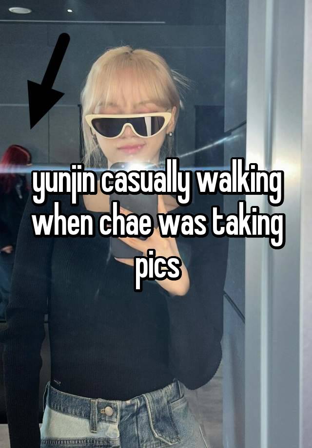 yunjin casually walking when chae was taking pics