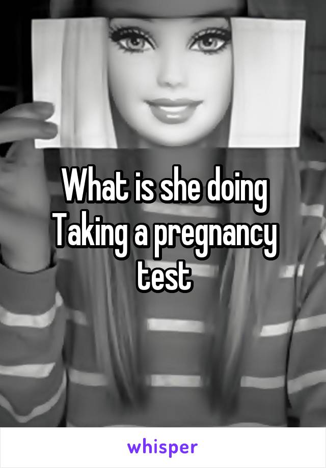 What is she doing
Taking a pregnancy test